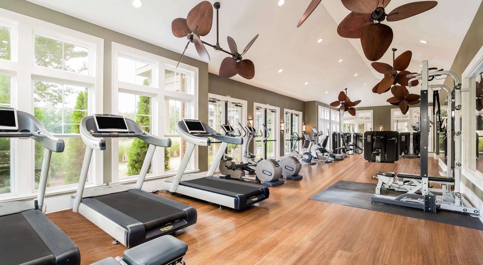 Get your workout on a room with exercise equipment and a large window