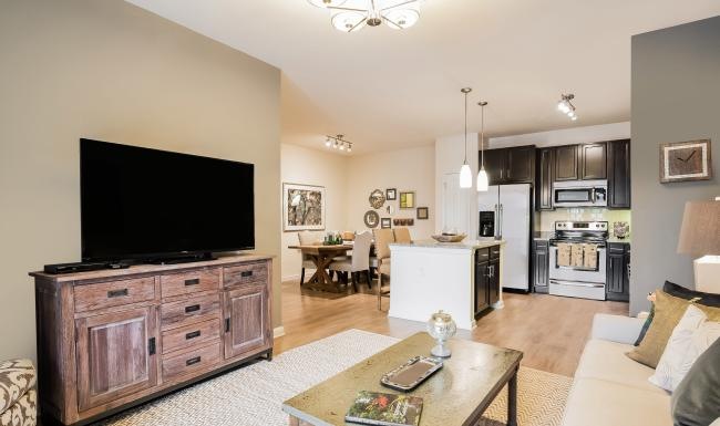 a living room with a tv and a table