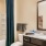 a bathroom with a sink toilet and a mirror