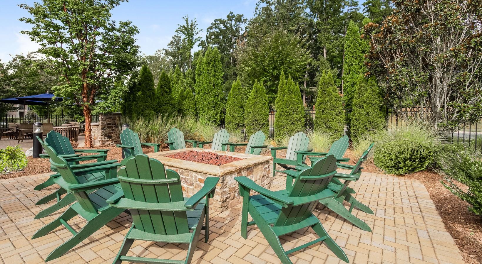 A beautiful community at the heart of all your passions a group of chairs on a patio