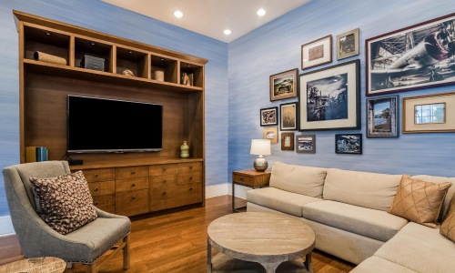 a living room with a tv and couches