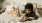 a boy reading a book to a dog