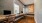 a room with a desk and chairs
