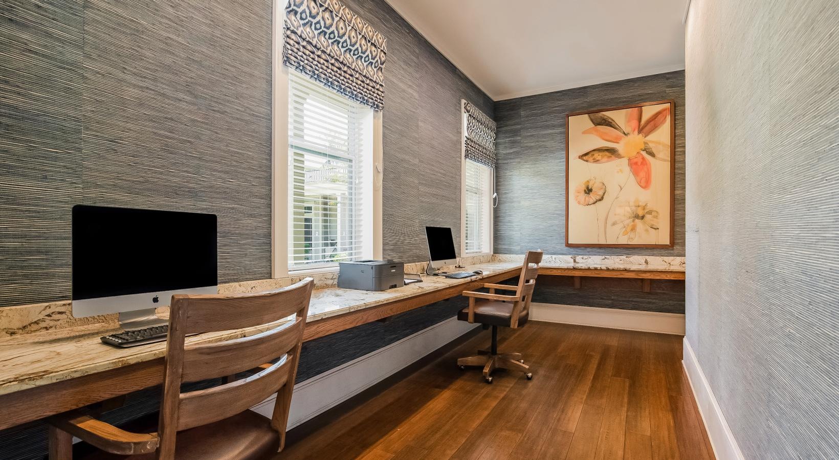 The essence of exceptional living a room with a desk and chairs