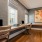 a room with a desk and chairs