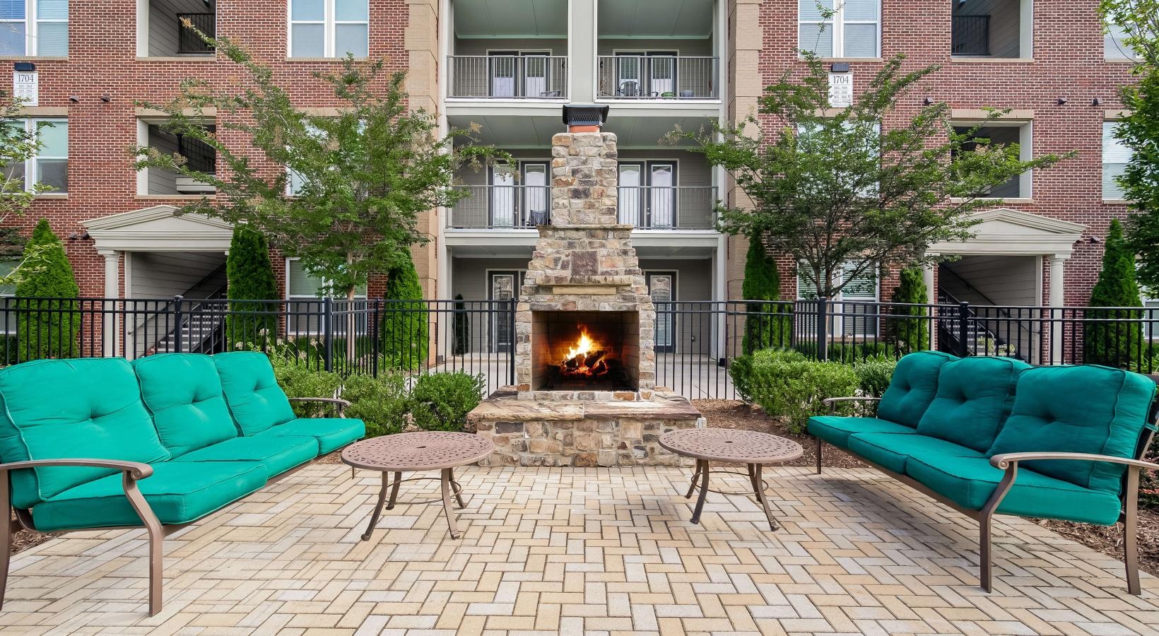 Enjoy our resident-only features a fire pit in front of a building