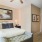 a bedroom with a bed and lamps