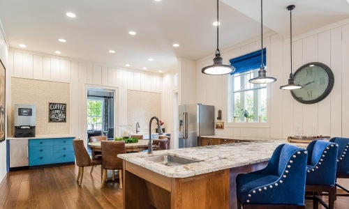 a kitchen with a marble island