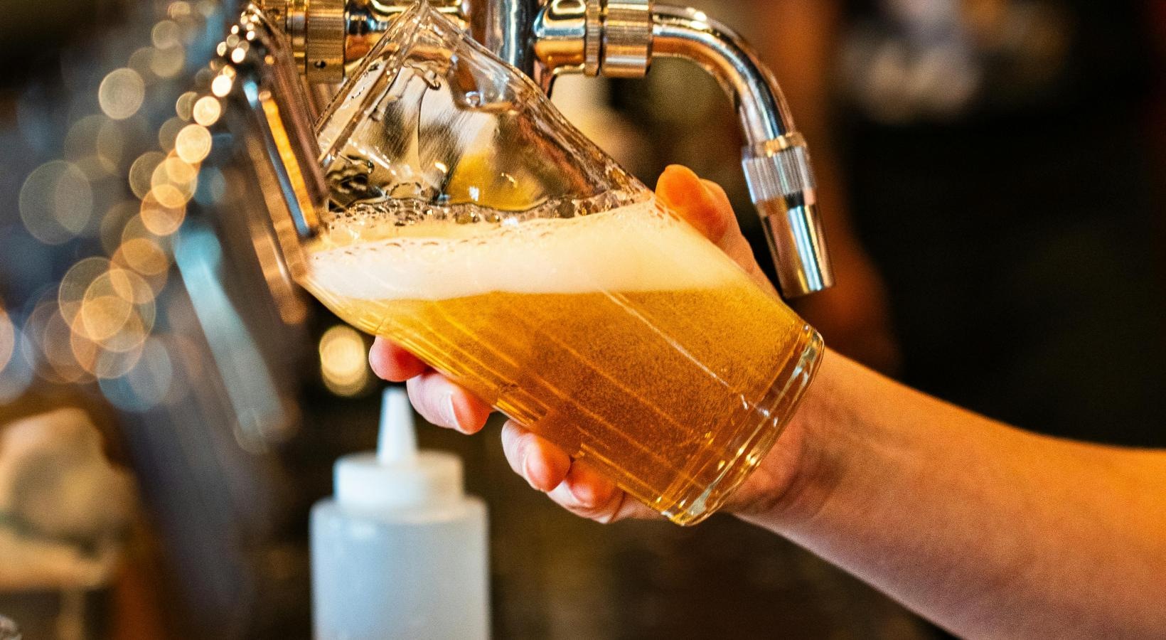 Vibrant community life with a variety of dining options a person pouring liquid into a bottle