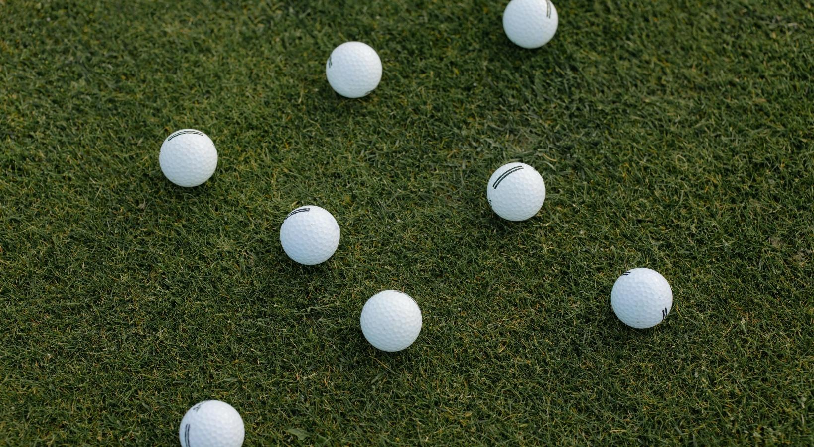 Settle into comfort at Alexander Village a group of white balls on grass