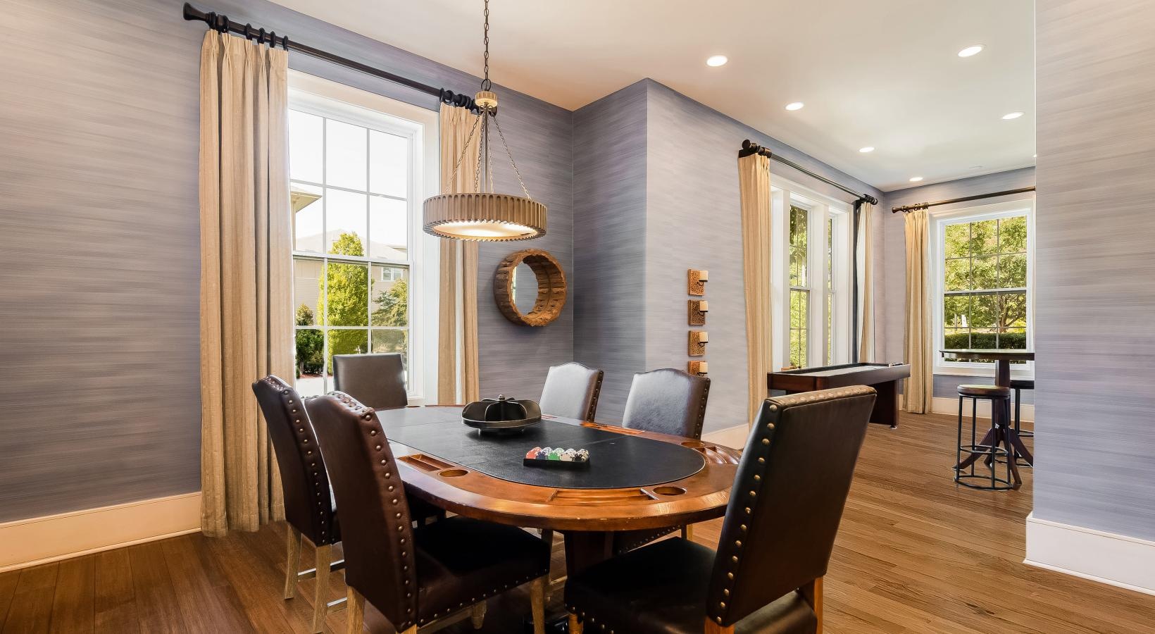 Access to resident-only features a dining room with a chandelier and a table