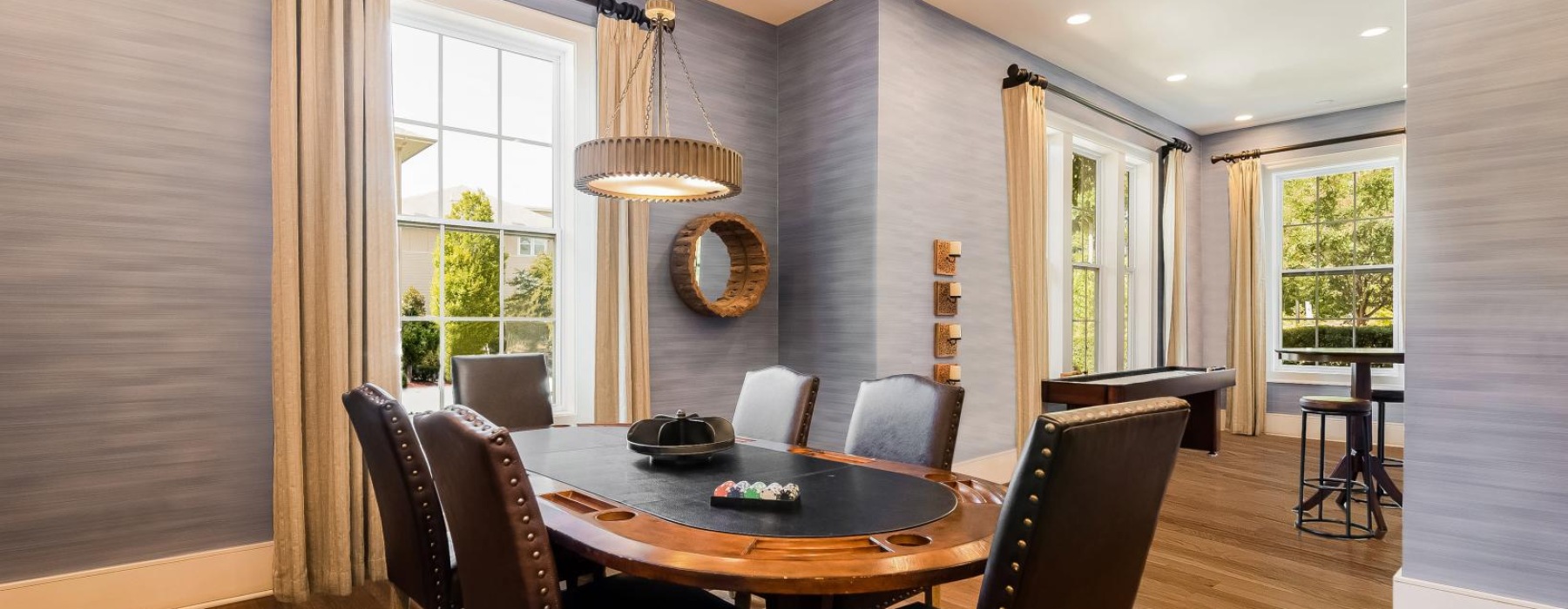 a dining room with a chandelier and a table