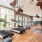 a room with exercise equipment and a large window