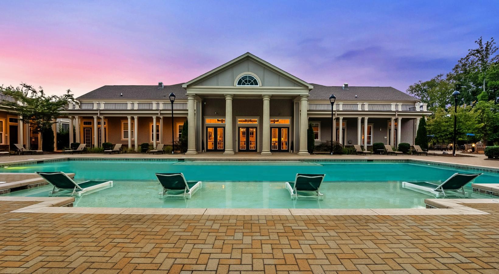 Resort-style swimming pool a house with a pool