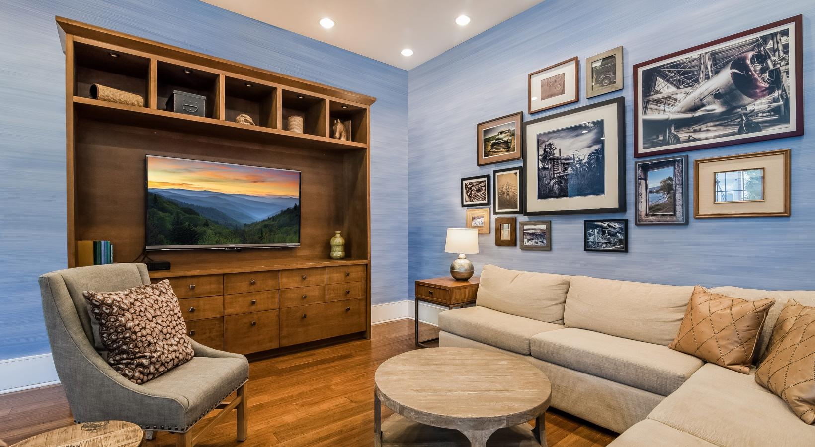Settle into comfort at Alexander Village a living room with a large wall of art