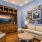 a living room with a large wall of art