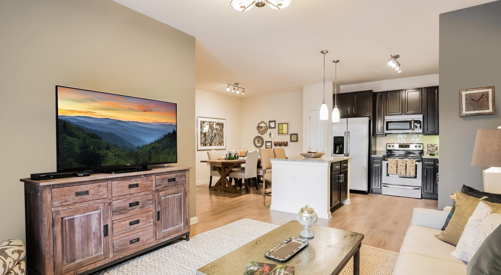 Wide open living areas perfect for entertaining a living room with a large painting