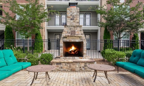 a fire pit in front of a building